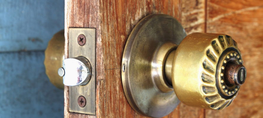 Utah home builder metal handle on a wooden door